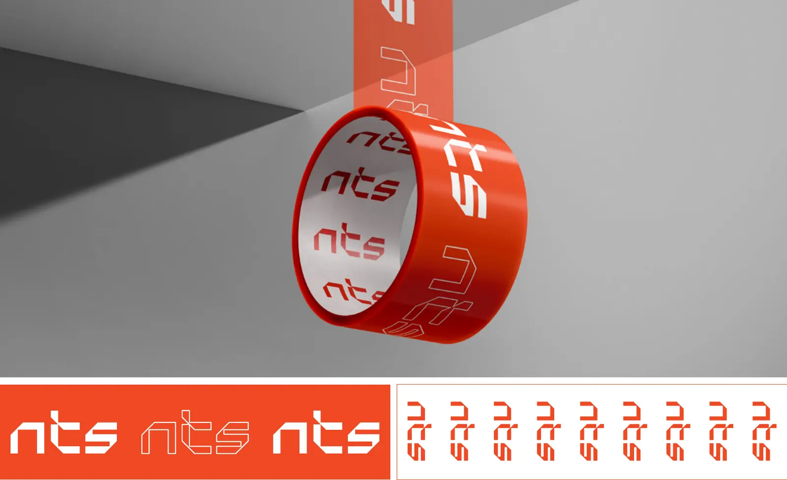 Roll of orange NTS packing tape printed with a repeating white logo