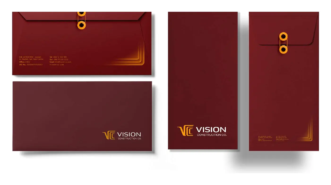 Dark red VCC envelopes with golden string closures and the logo in the corner