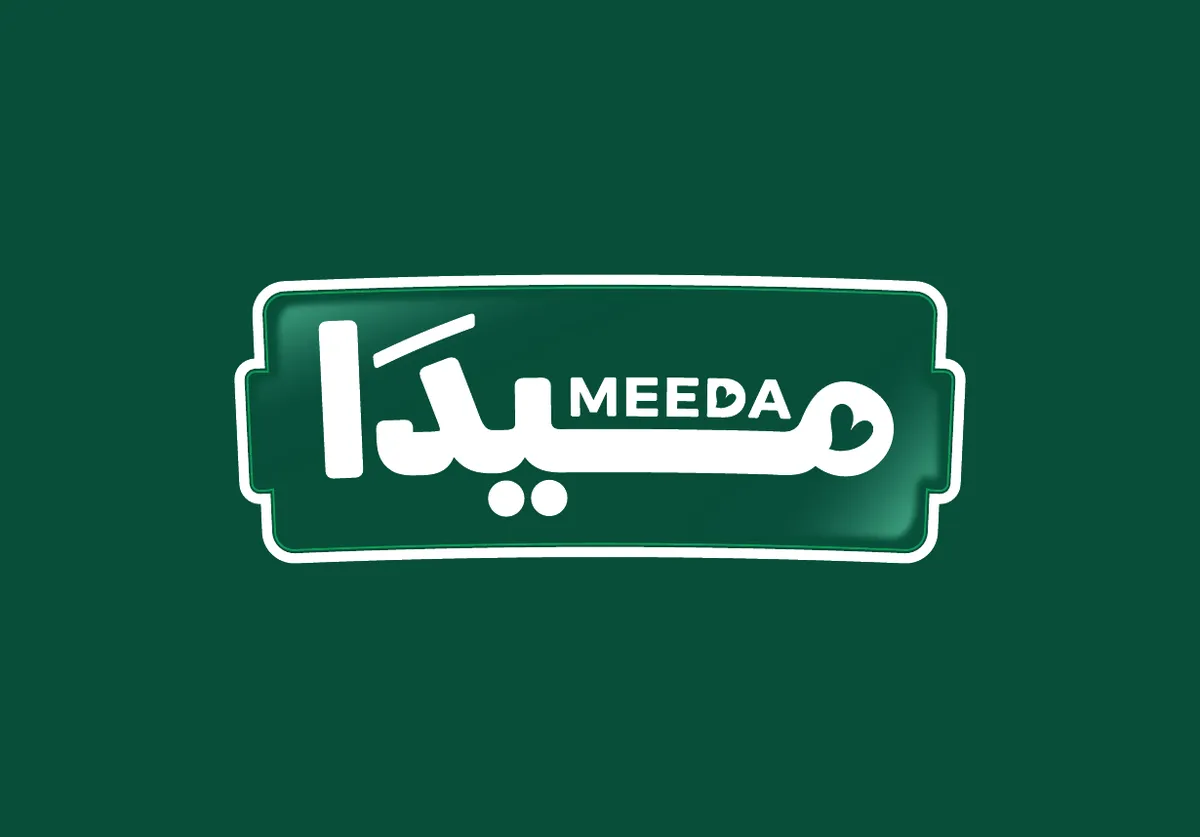 Meeda mobile app for ordering frozen food, surrounded by fresh fruit on green