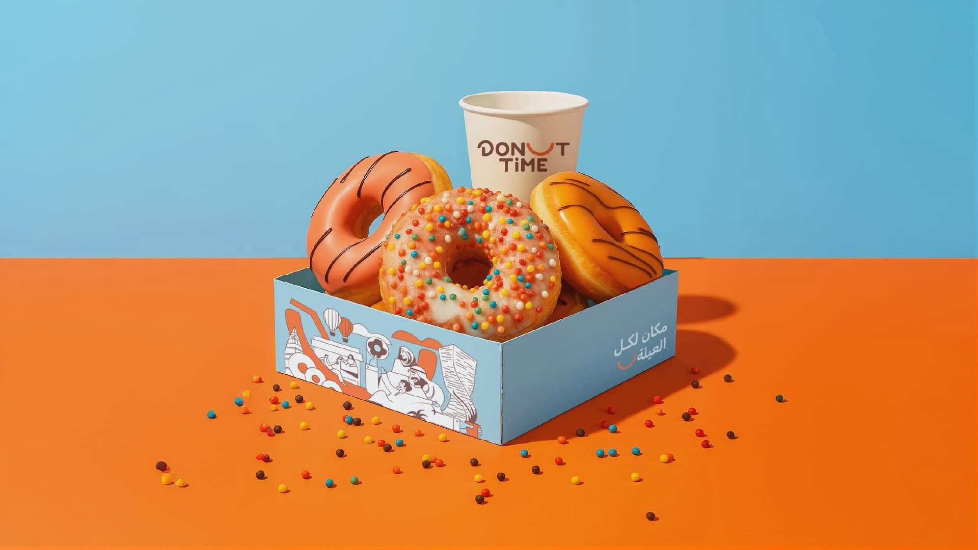 Two Donut Time paper bags with orange handles and line illustrations of Saudi families enjoying donuts and coffee