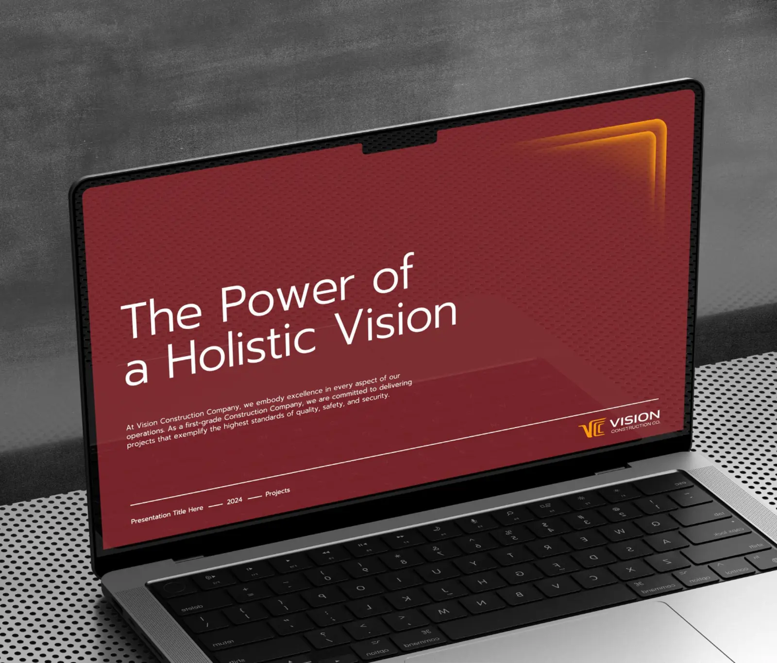 VCC presentation template on a laptop, with the headline The Power of a Holistic Vision on dark red